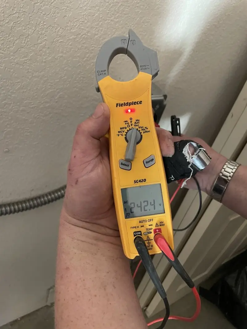 Voltage testing with clamp meter during Recessed Lighting Installation in Uwchlan